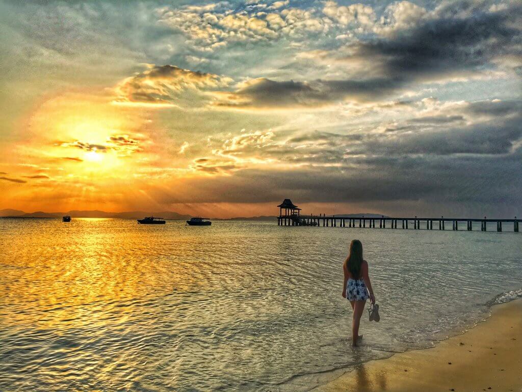 Sunset walk along the beach at Santhiya Koh Yao Yai