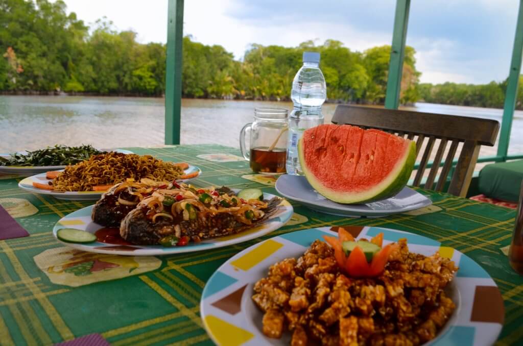 Lunch spread onboard kelotok with Orangutan Applause in Tanjung Puting national park, Borneo, Indonesia