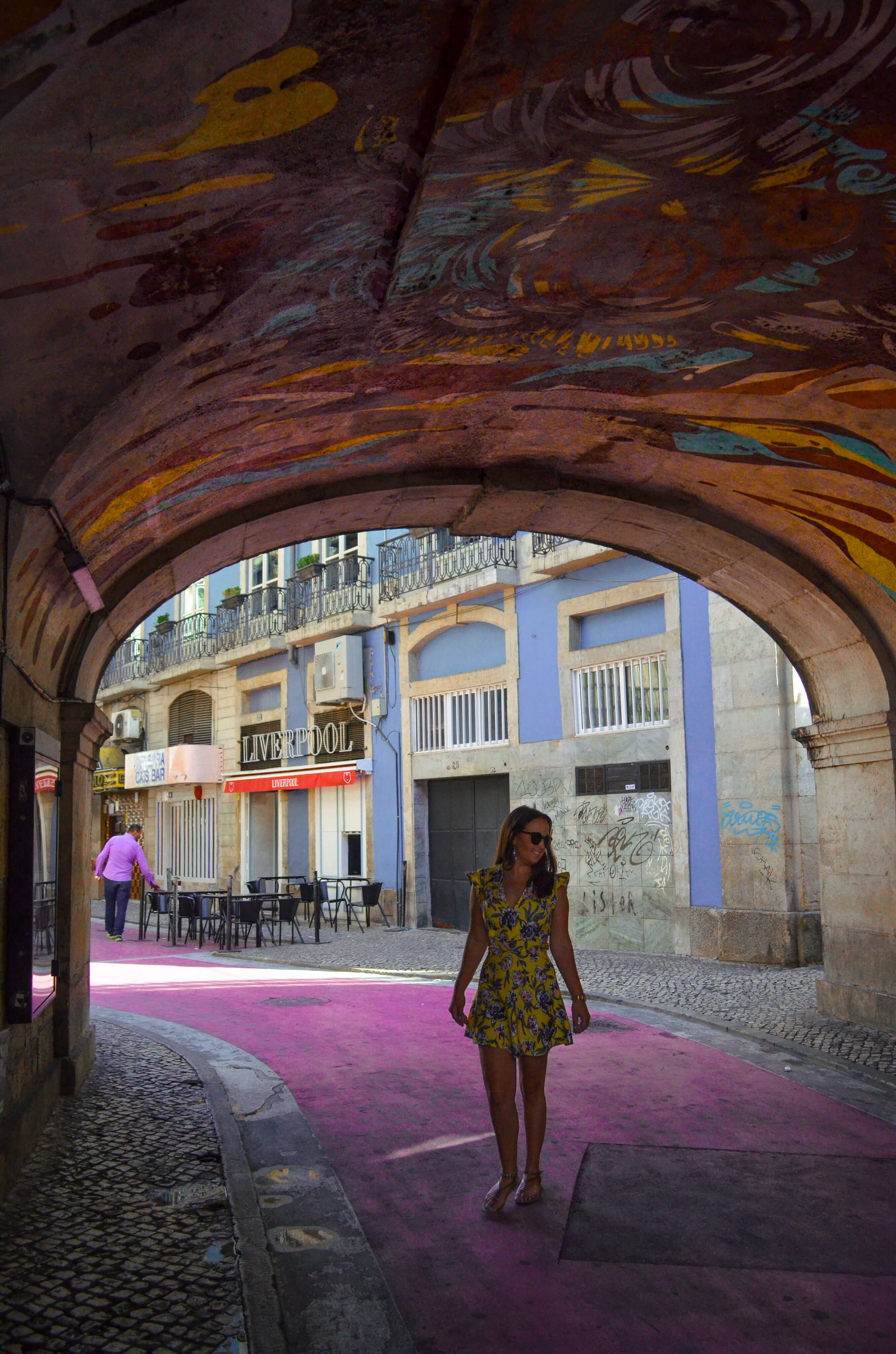 Pink street and street art in Lisbon, Portugal