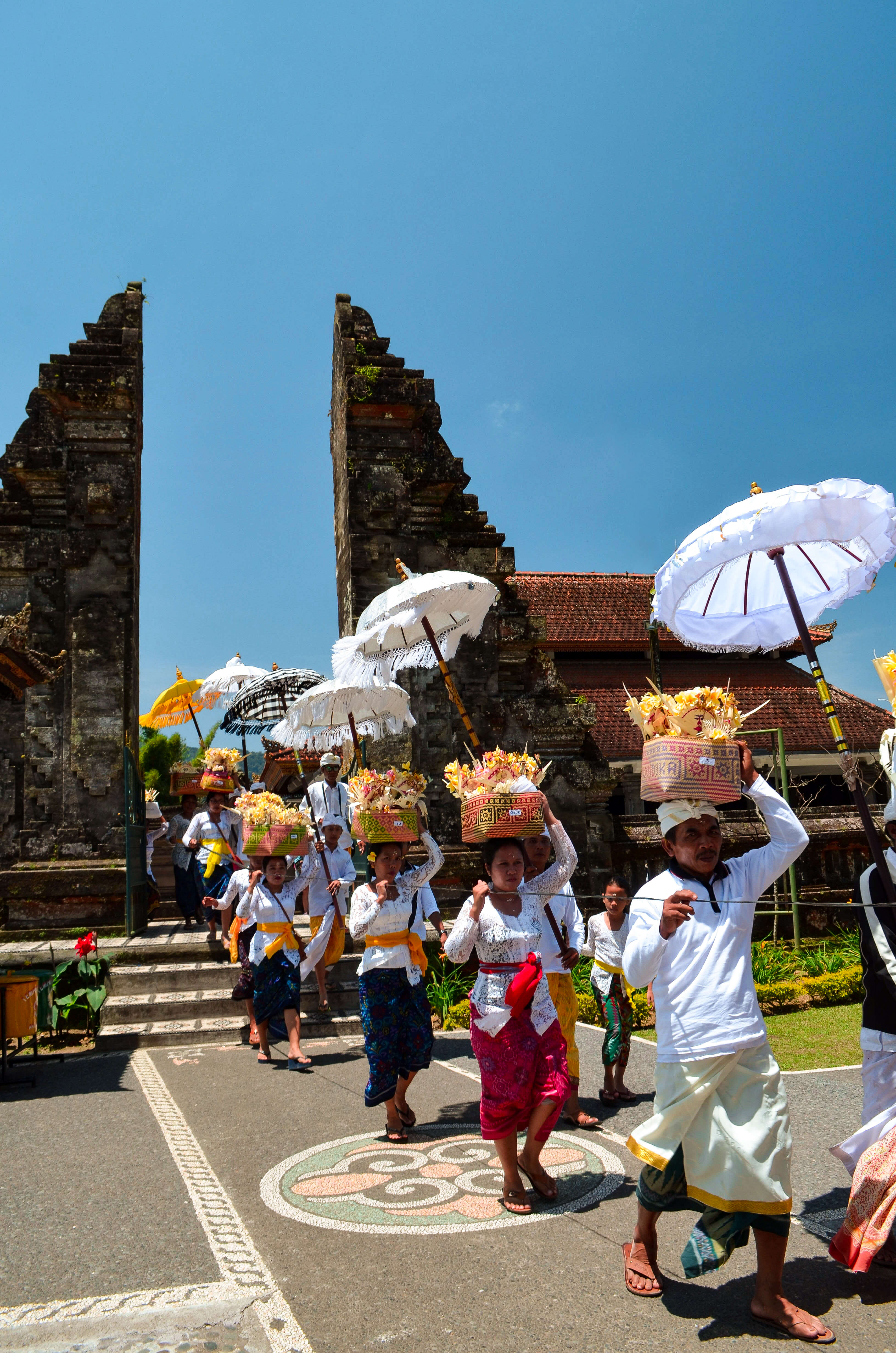 Bali Golden Tour - Ceremonial procession at Ulun Danu Beratan temple in Northern Bali, Indonesia