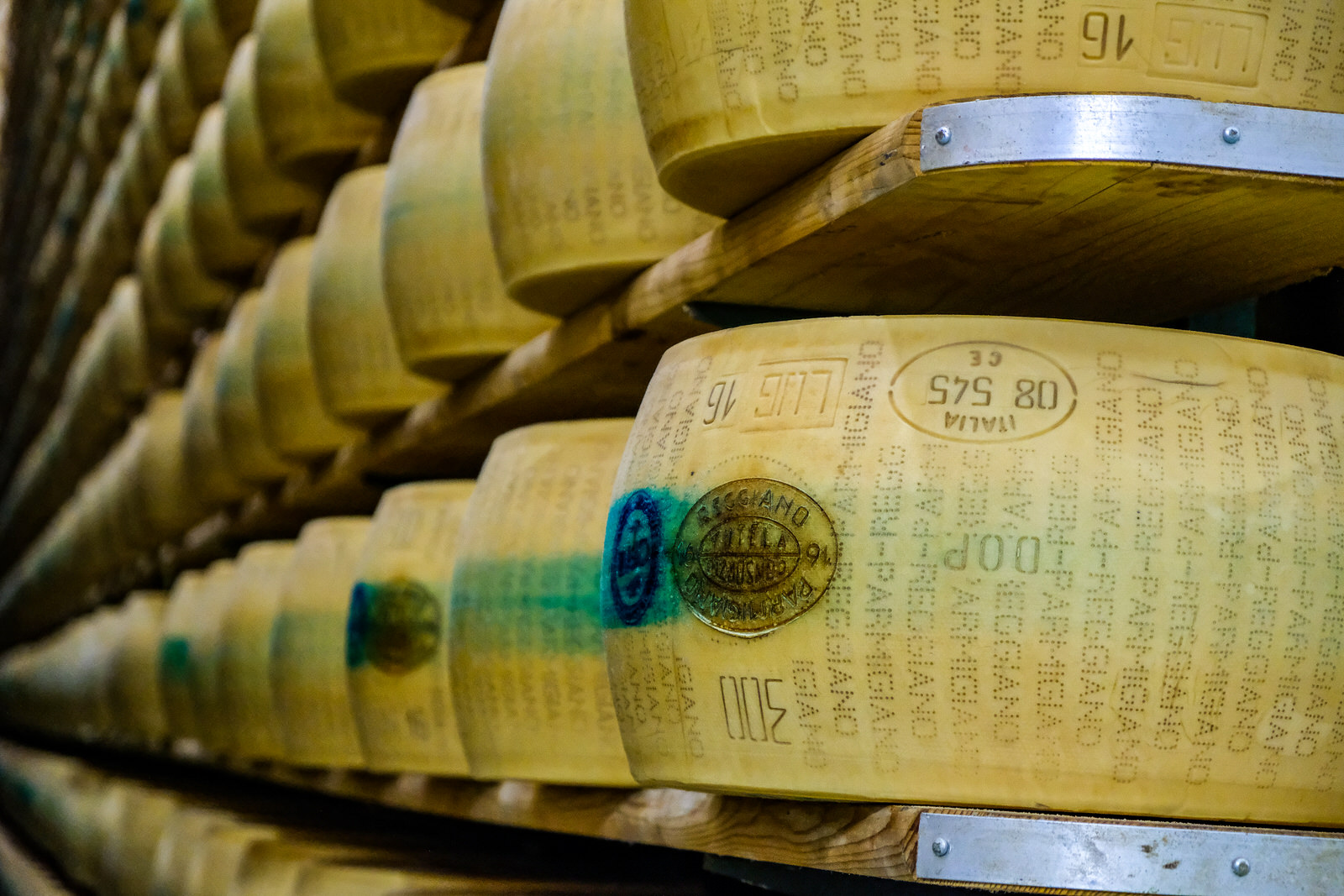 Exploring Italy's famous food region - Parmigiano Reggiano wheels of cheese