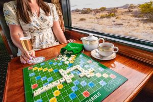 Rovos Rail - Playing scrabble with sparkling wine on board the Pride of Africa, South Africa's luxury train