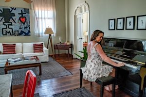 Las Clementinas - living space in apartment 5 with piano, Panama City, Panama