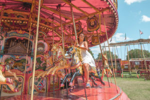 Riding the Steam Gallopers carousel at Carters Steam Fair, London