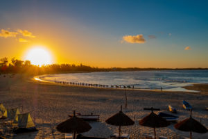 Sunsets on the beach and locals surfing in Tofo, Mozambique