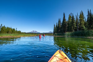 Kayaking on Hosmer Lake in the Cascades with Wanderlust Tours in Bend, Oregon