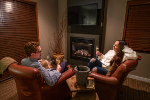 Raven room fireplace with armchairs at Brewery Gulch Inn, Mendocino, California