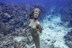 Mermaid statue at the house reef of Sunset House dive resort, Grand Cayman