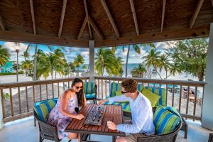 Playing mancala in the crow's nest at Southern Cross Club, Little Cayman, Cayman Islands